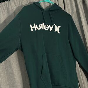 A Hurley dark teal hoodie, in a size medium women’s.